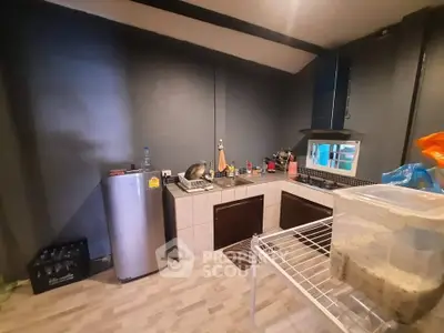 Cozy kitchen with modern appliances and sleek design, perfect for culinary enthusiasts.