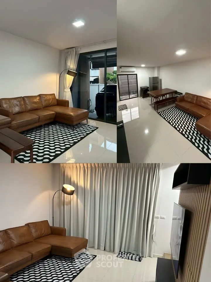 Modern living room with leather sofa and stylish decor in a spacious open layout.