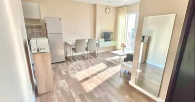 Bright modern living room with dining area and large mirror