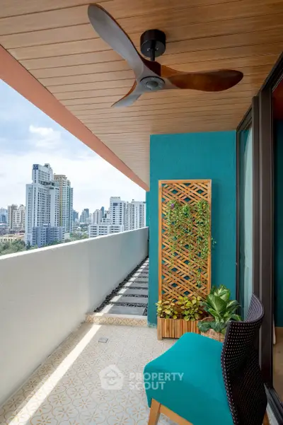 Stylish balcony with city view, modern ceiling fan, and lush greenery for urban living.
