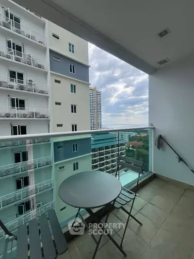 Charming balcony with city view, perfect for relaxation and enjoying the skyline.