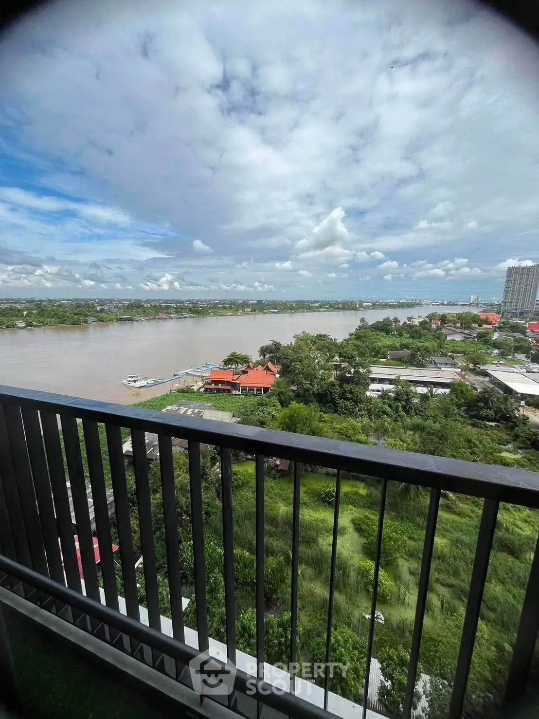 Stunning river view from a high-rise balcony, perfect for serene living.