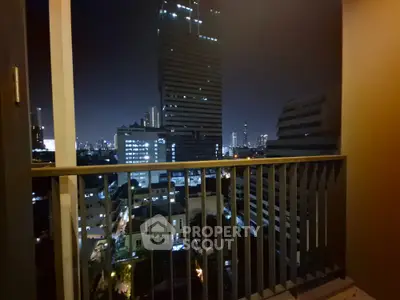 Stunning cityscape view from a modern balcony at night, perfect for urban living enthusiasts.