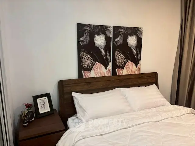 Cozy bedroom with elegant decor and wooden headboard