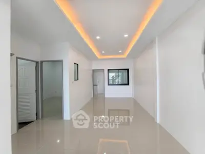 Spacious modern interior with sleek lighting and glossy tile flooring