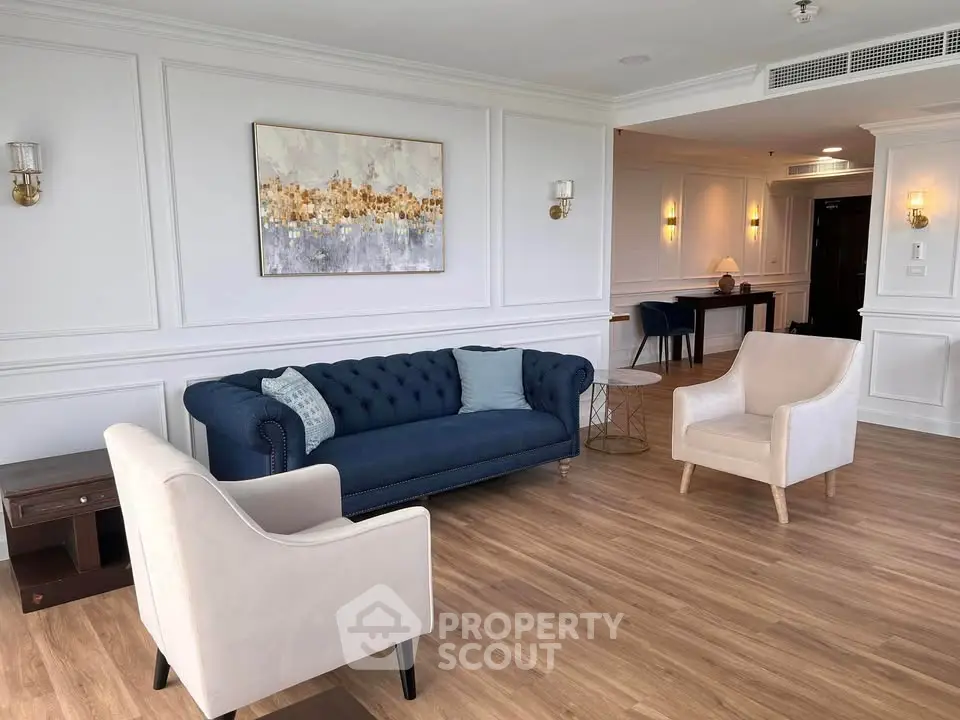 Elegant living room with stylish furniture and modern decor in a luxurious apartment.