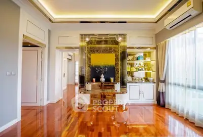 Luxurious living room with polished wooden floors and elegant decor