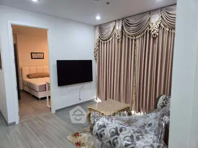 Elegant living room with luxurious curtains and cozy bedroom view