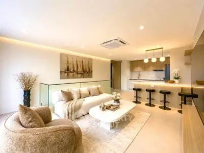 Luxurious open-plan living room with modern kitchen and elegant decor