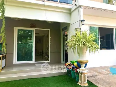 Charming home entrance with lush greenery and inviting decor