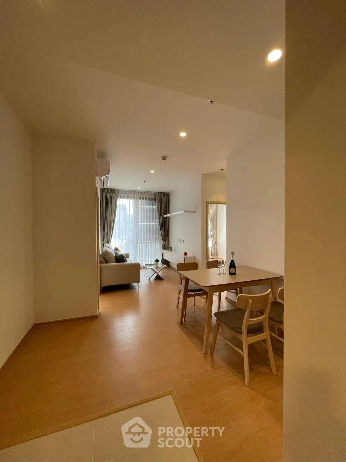 Spacious modern living room with dining area and natural light
