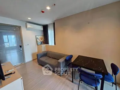 Modern living room with sleek furniture and natural light, perfect for urban living.