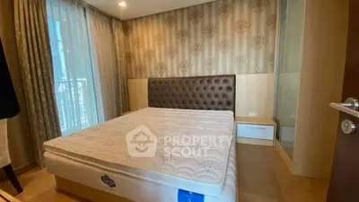 Luxurious bedroom with elegant wallpaper and large window for natural light