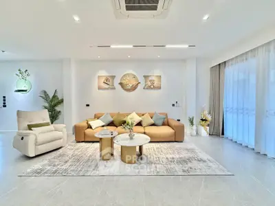 Luxurious modern living room with elegant decor and spacious seating area