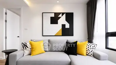 Modern living room with stylish decor and bright yellow accents