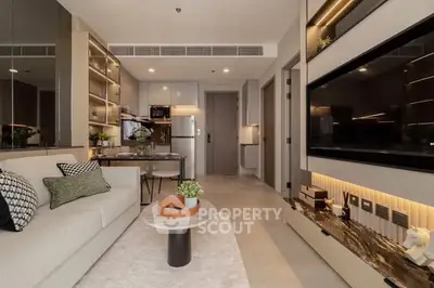 Modern living room with stylish decor and open kitchen layout in a contemporary apartment.