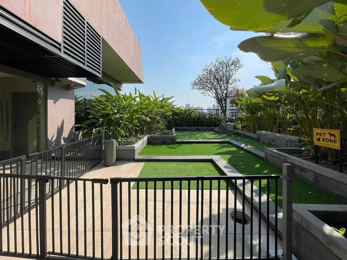 Luxurious rooftop garden with pet-friendly zone and lush greenery, perfect for relaxation and leisure.