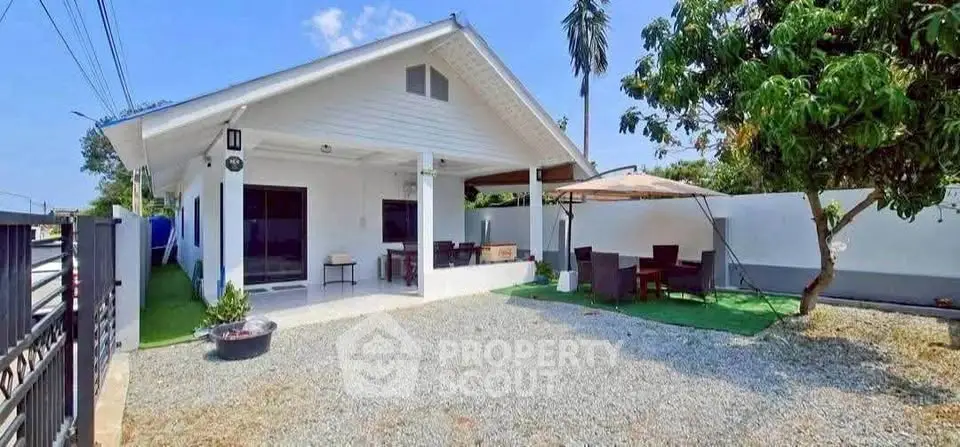 Charming single-story home with spacious outdoor area and covered patio, perfect for relaxation and entertaining.