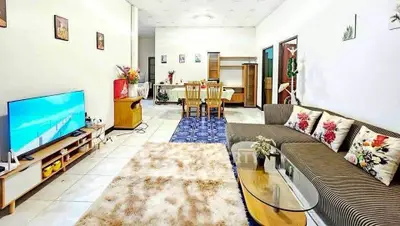 Spacious living room with modern decor and cozy seating area