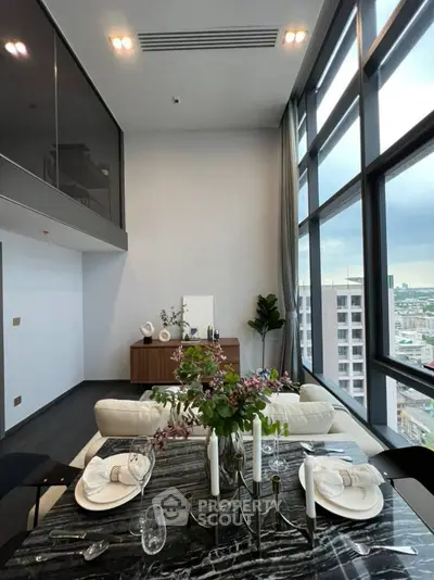 Luxurious high-rise living room with floor-to-ceiling windows and elegant dining setup.