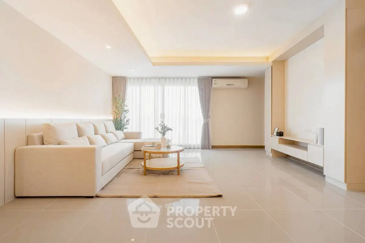 Spacious modern living room with elegant decor and natural light