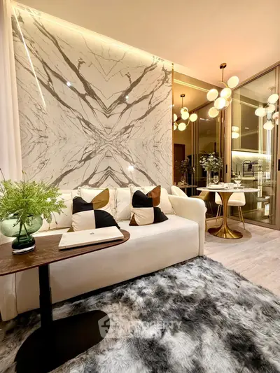 Luxurious modern living room with marble accents and elegant lighting