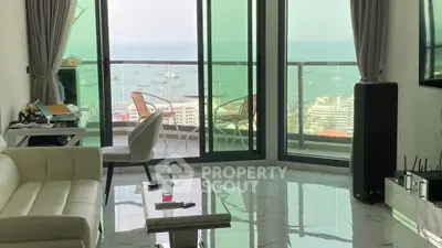 Luxurious living room with stunning ocean view and spacious balcony.