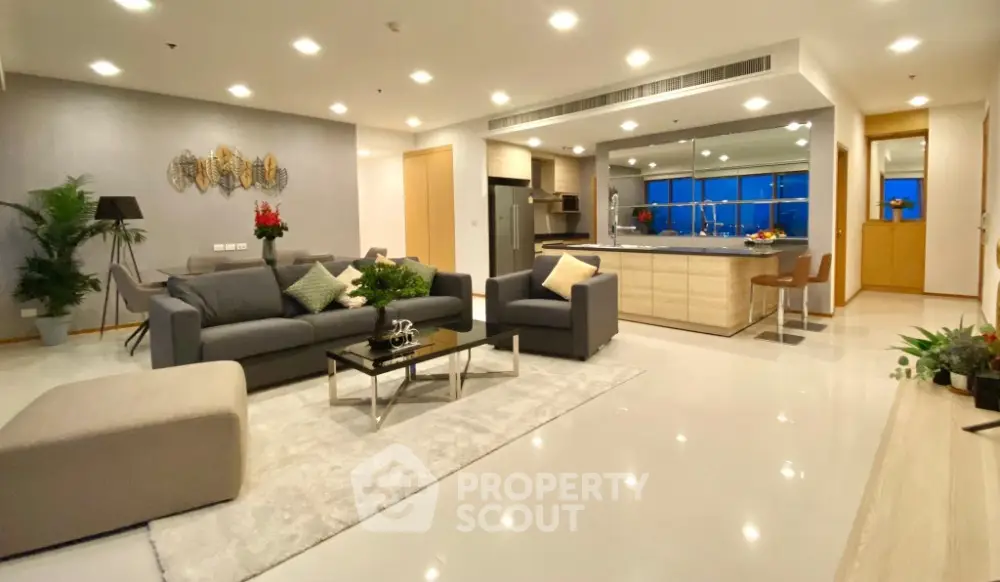 Luxurious open-plan living room with modern kitchen and elegant decor