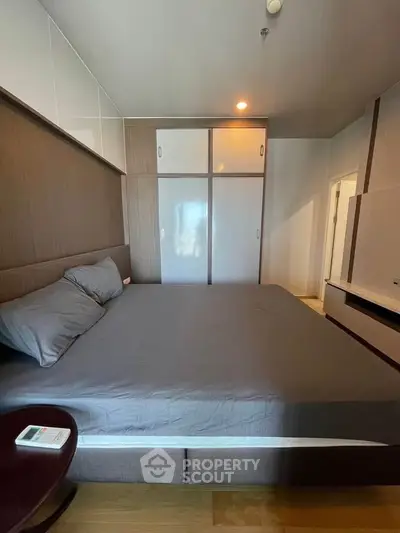 Modern bedroom with sleek design and ample storage space