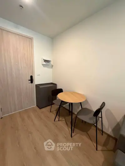 Cozy modern living area with minimalist furniture and wooden flooring