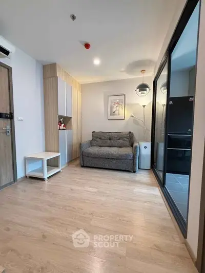 Modern living room with cozy sofa and stylish decor in a contemporary apartment.