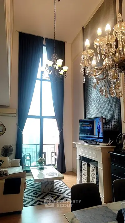 Luxurious high-ceiling living room with elegant chandeliers and large windows