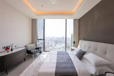 Luxurious bedroom with stunning city view and modern decor