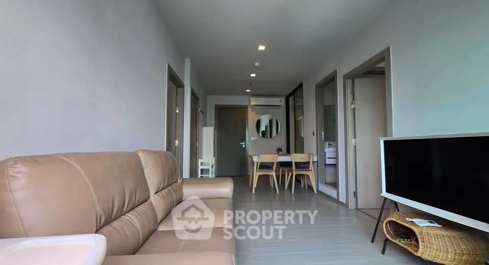 Modern living room with sleek furniture and open layout, perfect for contemporary living.