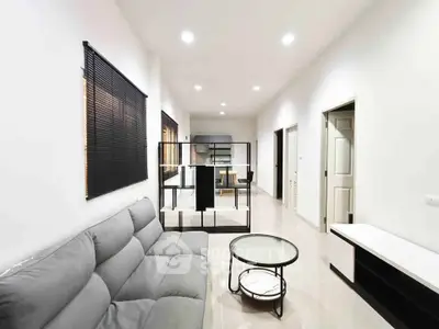Modern living room with sleek furniture and open layout, perfect for contemporary living.