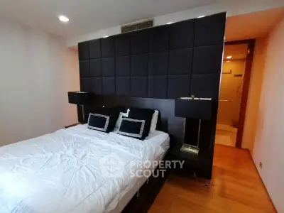 Modern bedroom with stylish headboard and cozy lighting