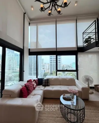 Luxurious high-rise living room with stunning city views and elegant decor.