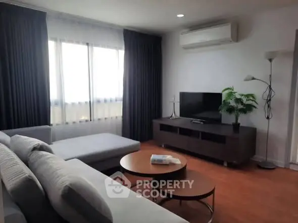Modern living room with sleek furniture and natural light
