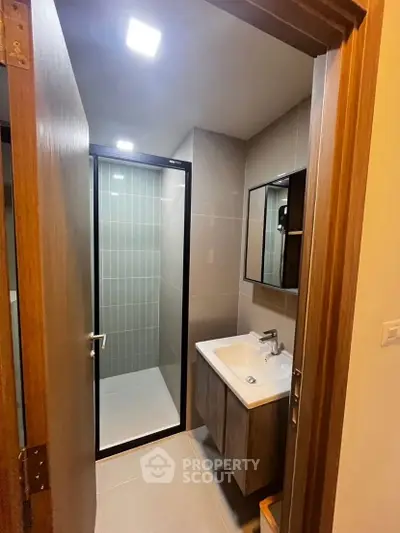 Modern bathroom with sleek design and glass shower enclosure