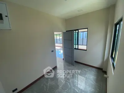 Modern empty room with glossy tiled floor and large windows