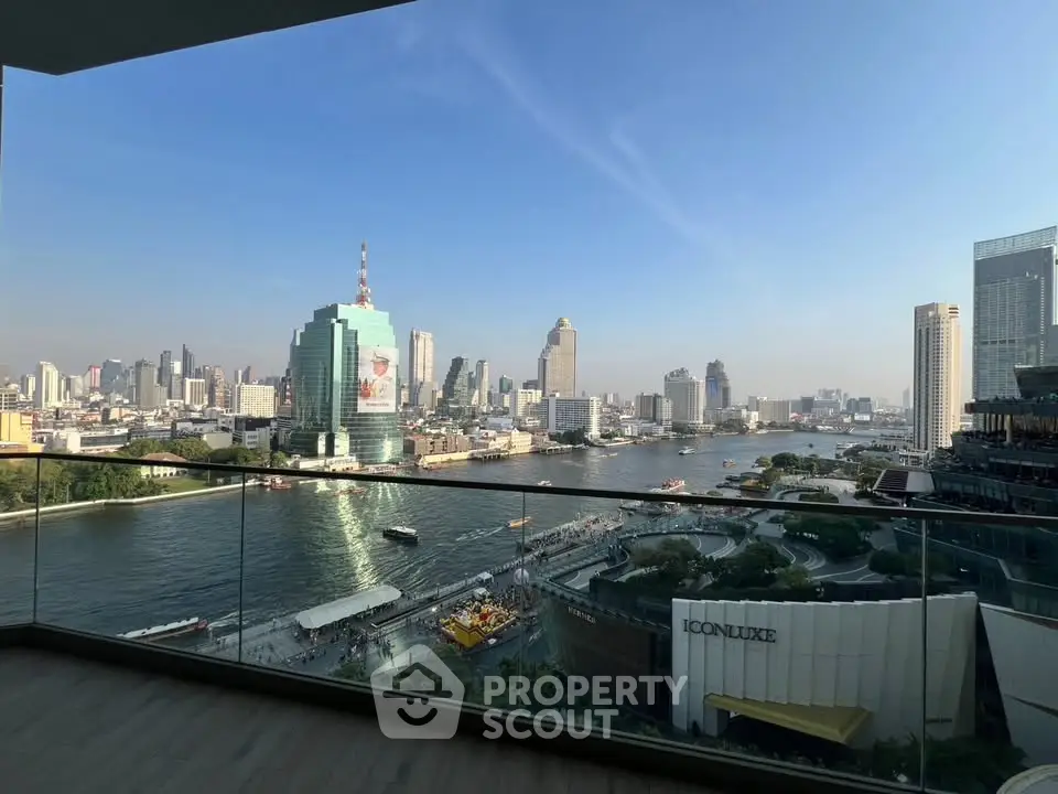 Stunning cityscape view from a high-rise balcony overlooking a river and skyline, perfect for urban living.