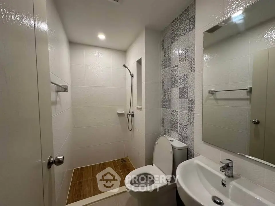 Modern bathroom with sleek fixtures and stylish tile accents