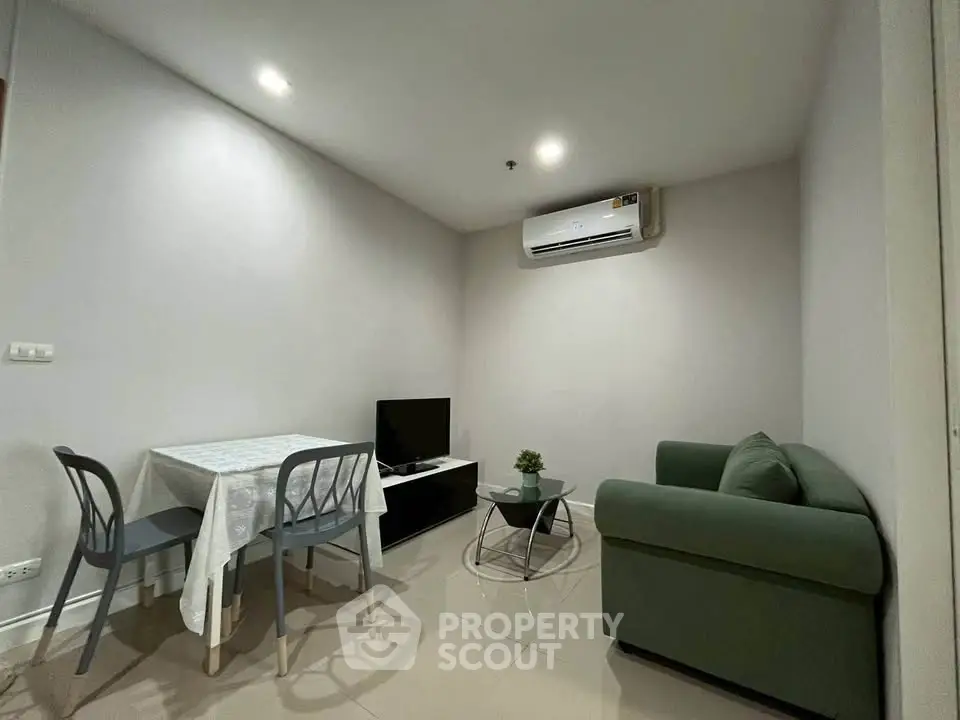 Cozy living room with modern furniture and air conditioning in a stylish apartment.