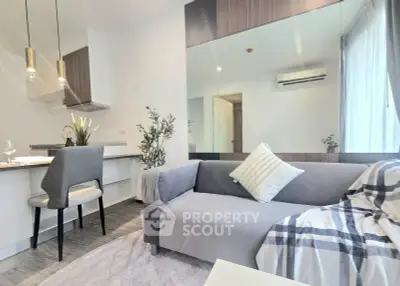 Modern living room with stylish decor and open kitchen layout