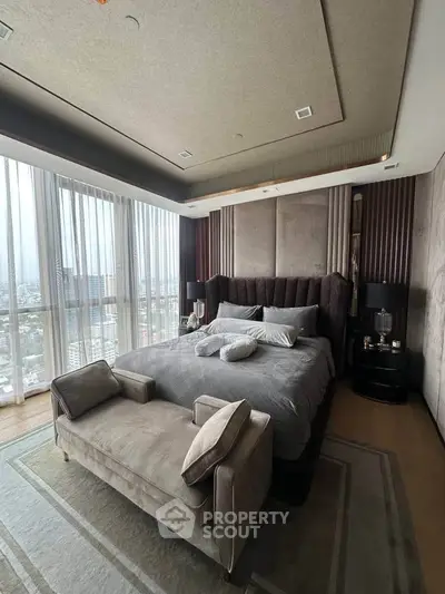 Luxurious bedroom with panoramic city views and elegant decor