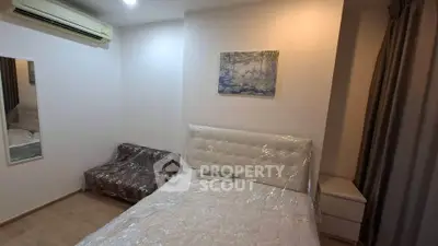 Cozy bedroom with air conditioning and modern decor in a stylish apartment.