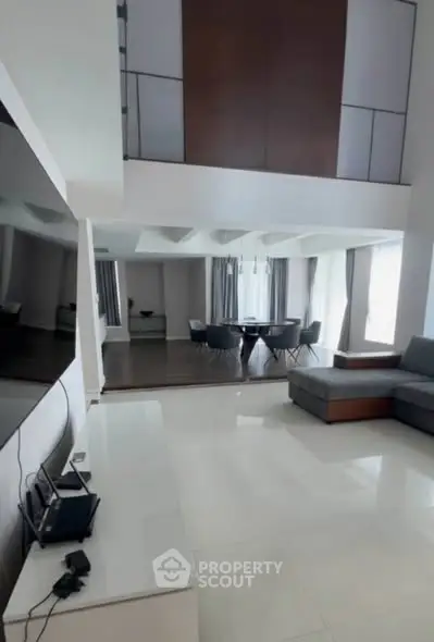 Spacious modern living room with high ceilings and elegant decor