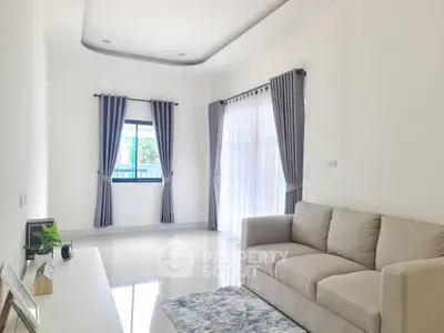 Bright and airy living room with modern sofa and elegant curtains