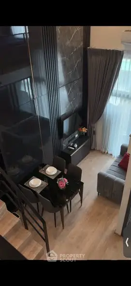 Modern duplex living room with elegant decor and dining area