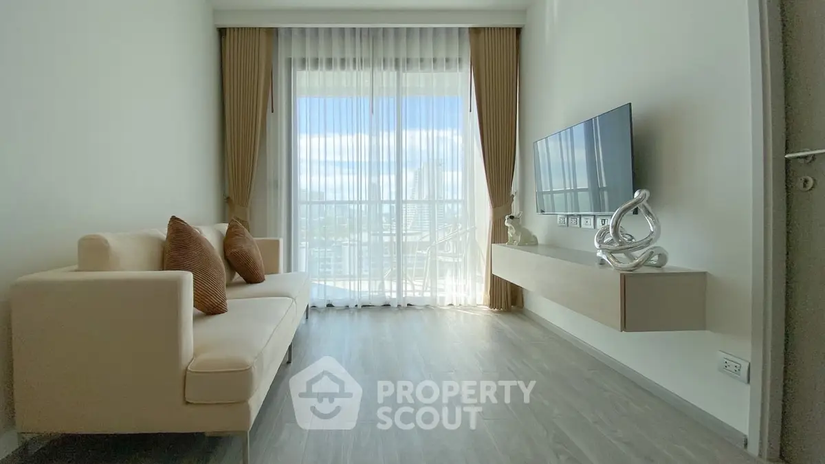 Modern living room with large window and stylish decor